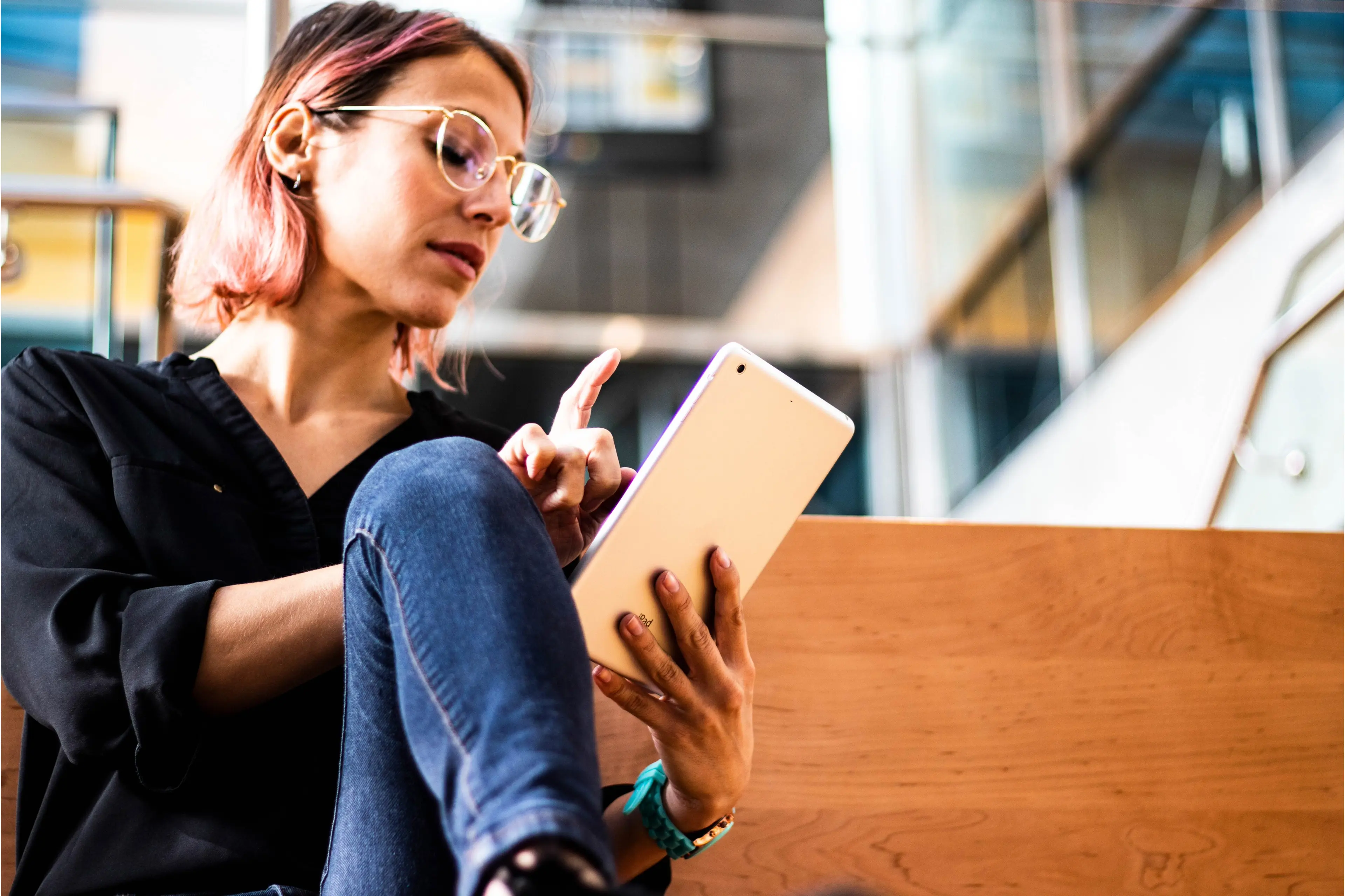 Smiling business woman using her digital tablet computer
